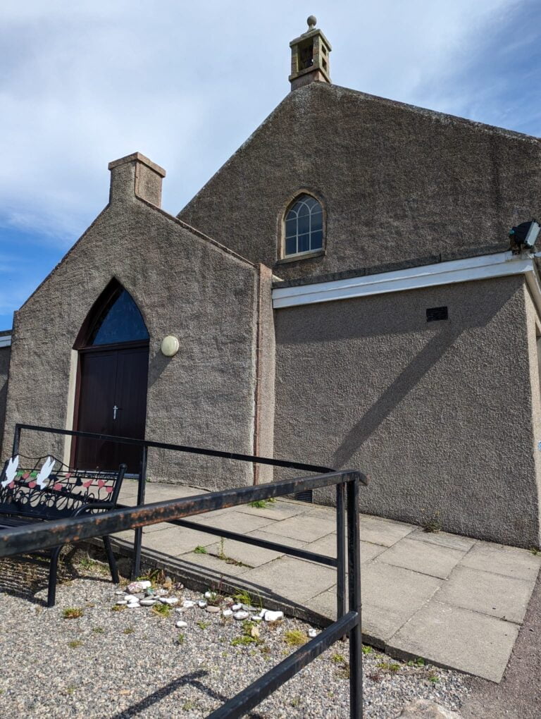 Exterior of Portlethen church, a ramp leading to the gothic wooden door